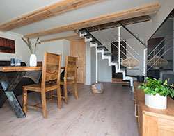 The open living area on the ground floor of the boathouse is bright and friendly. 