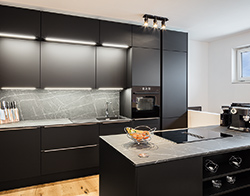 Architect Fuzzy's Woodart breaks with tradition and uses the trendy colour black in the design of this kitchen. 